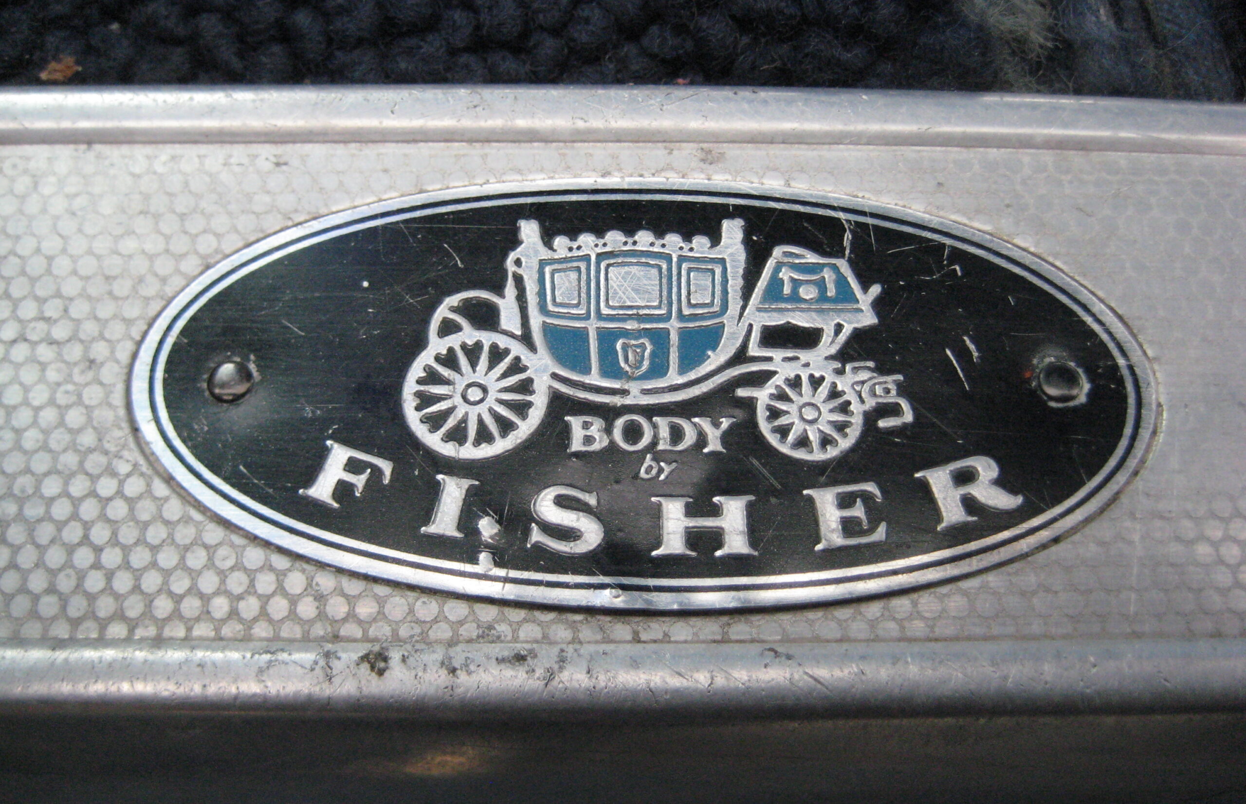 Body By Fisher door-sill emblem from a 1960 Buick Electra. (©Photo by Segura)