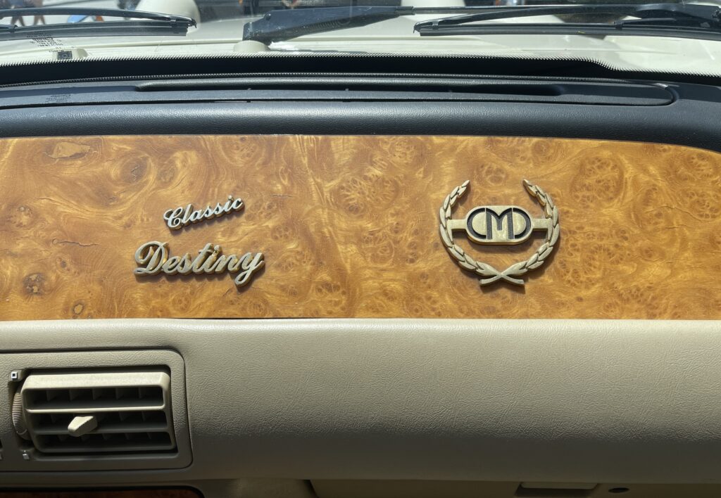 Classic Motor Carriages "CMC" Classic Destiny dash emblem. (©Photo by Segura)