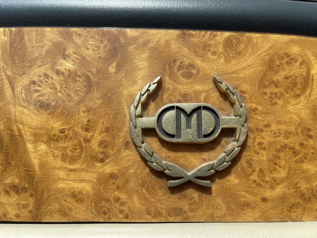 Classic Motor Carriages "CMC" Classic Destiny dash emblem. (©Photo by Segura)