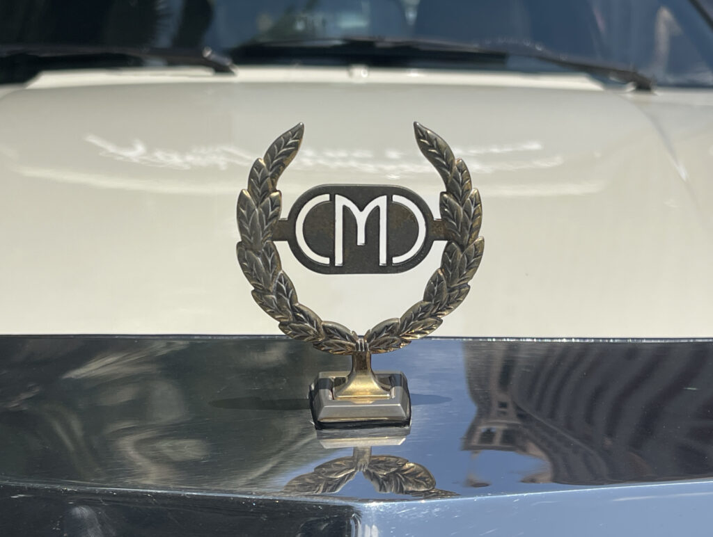 Classic Motor Carriages "CMC" hood ornament. (©Photo by Segura)