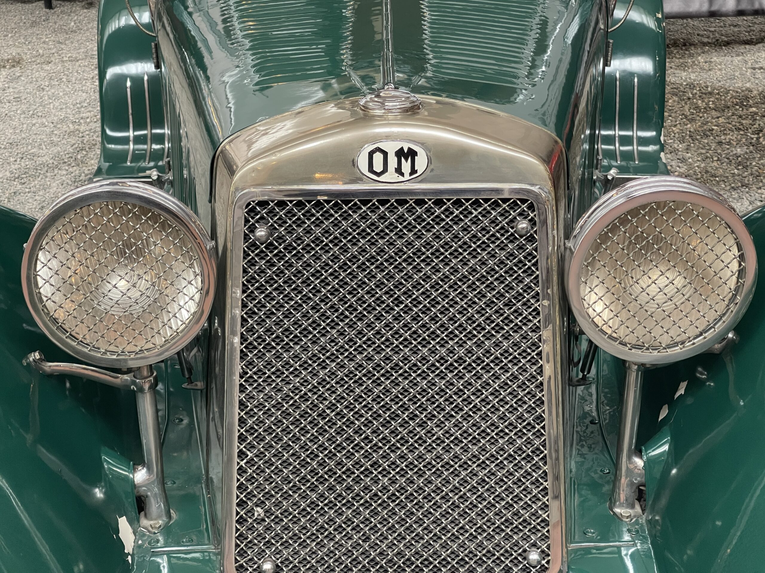 1931 OM (Officine Meccaniche) Roadster Type 665MM front grill emblem. (©Photo by Segura)