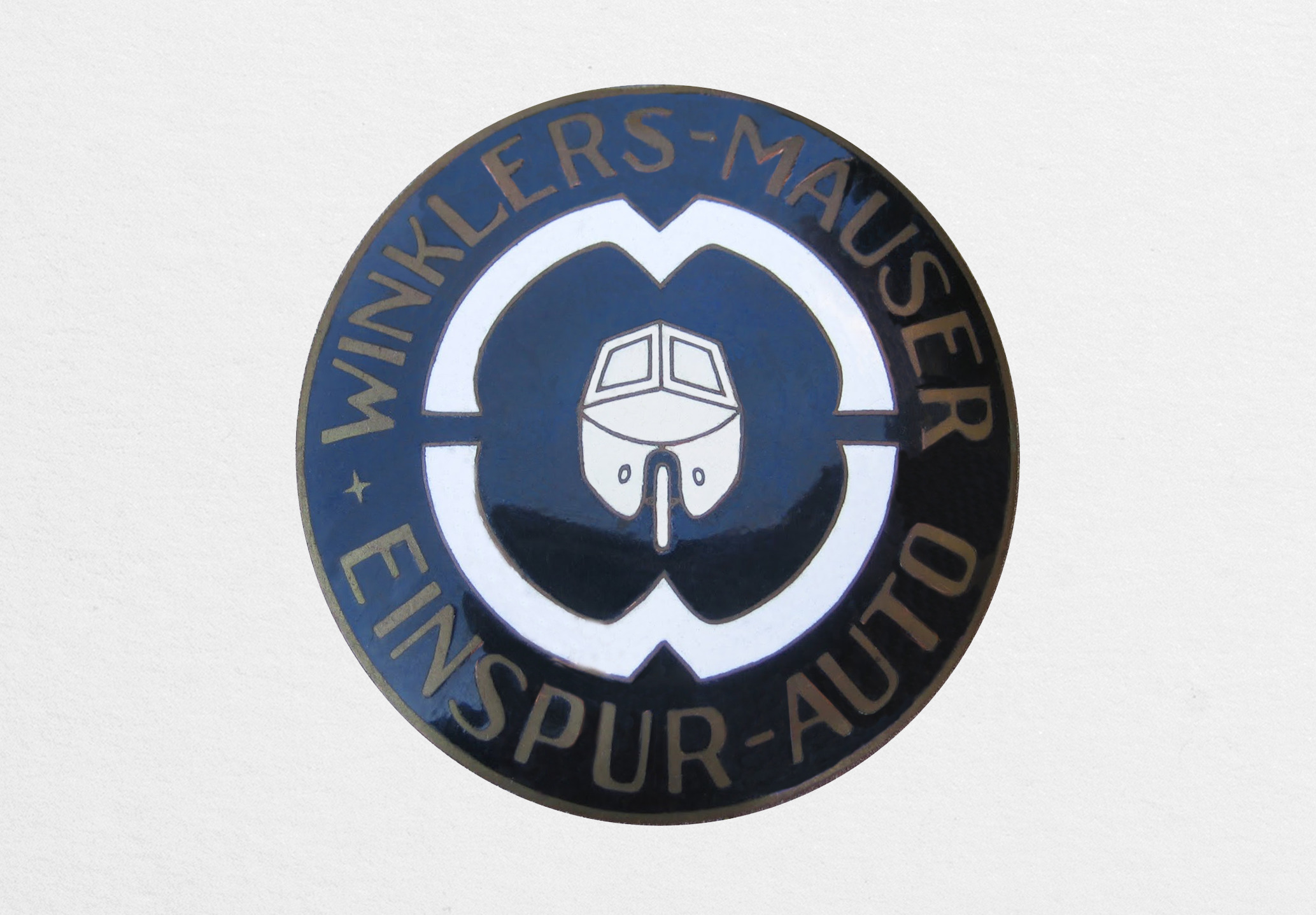 Winklers-Mauser Einspur-Auto emblem. (source: Radiator Emblem Collection)